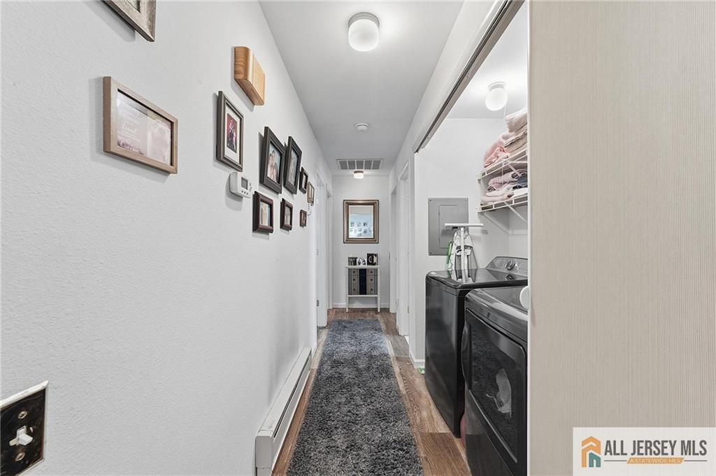 491A Delair Road, Unit 491B Monroe Township, NJ 08831 - Photo 11 of 22 a view of a hallway with washer and dryer