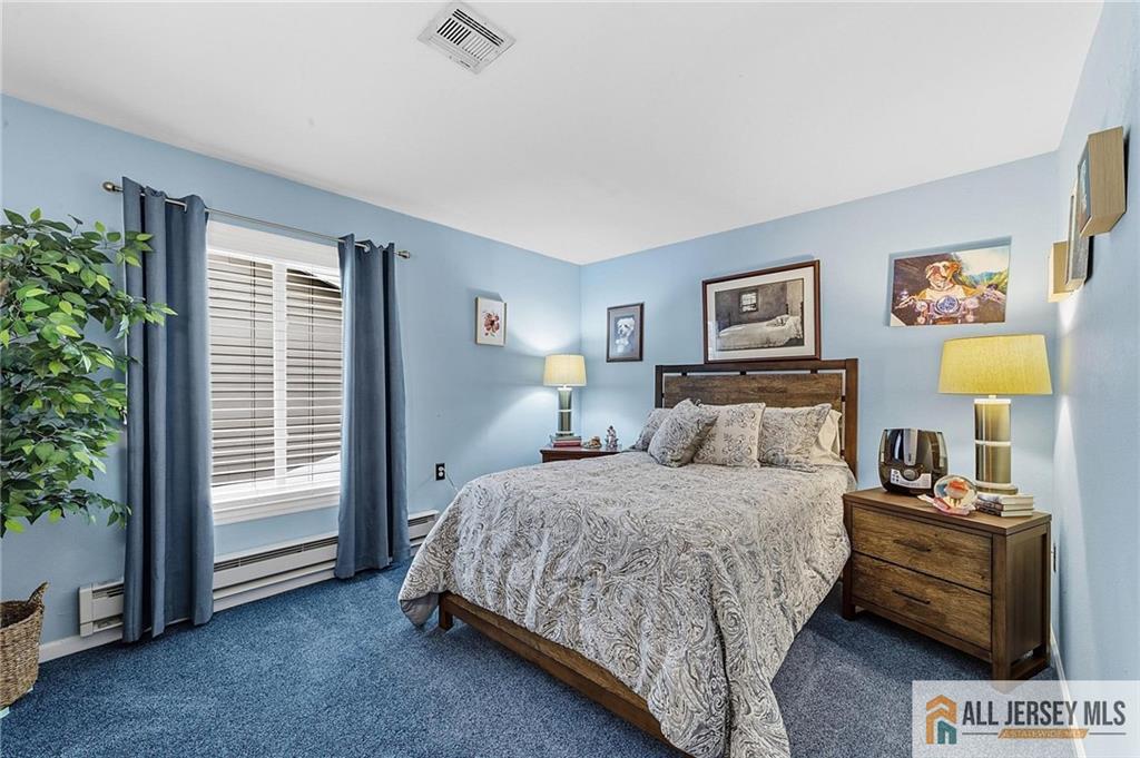 491A Delair Road, Unit 491B Monroe Township, NJ 08831 - Photo 14 of 22 a bedroom with a bed and a window