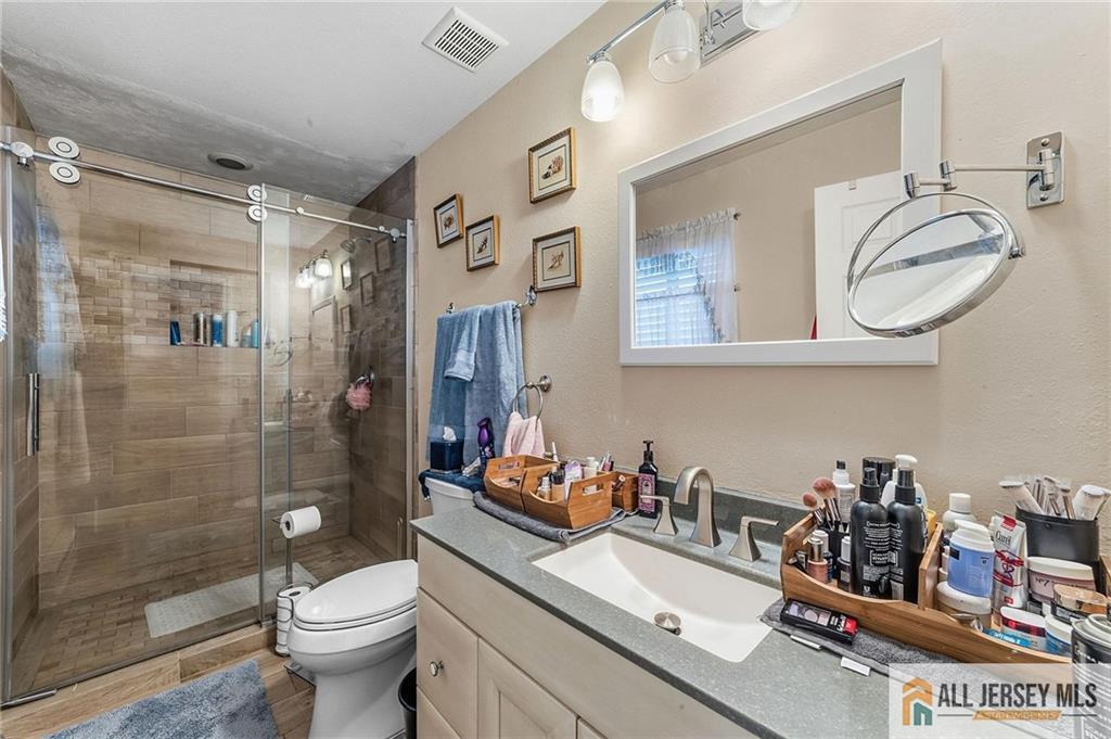 491A Delair Road, Unit 491B Monroe Township, NJ 08831 - Photo 17 of 22 a bathroom with a sink toilet and shower