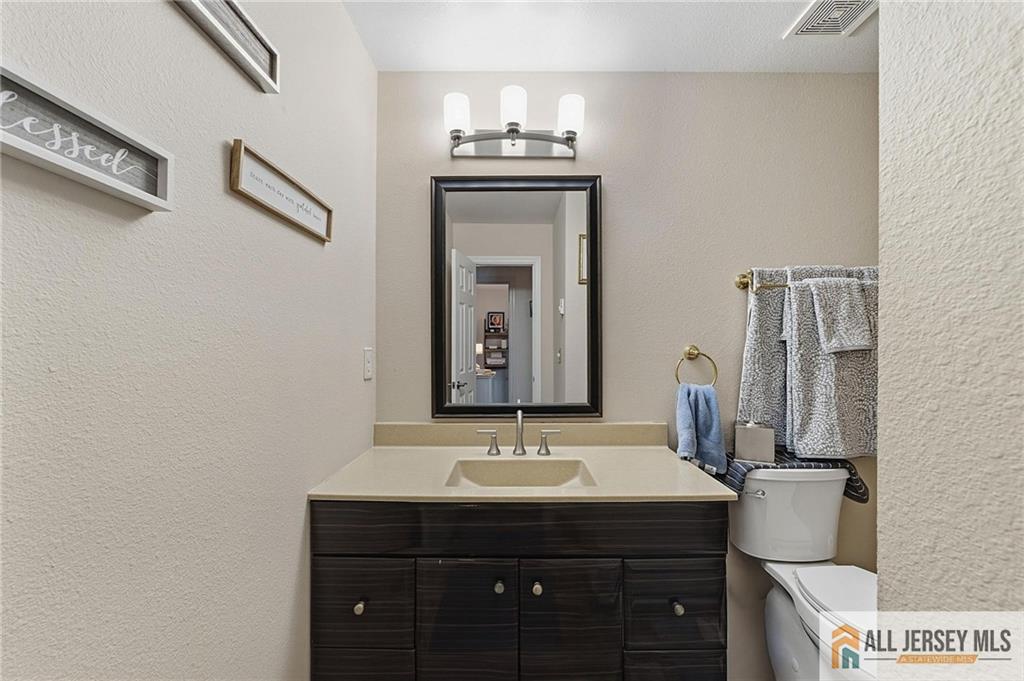 491A Delair Road, Unit 491B Monroe Township, NJ 08831 - Photo 18 of 22 a bathroom with a sink and a mirror