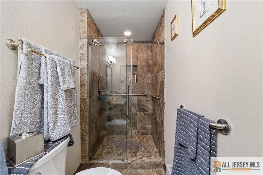491A Delair Road, Unit 491B Monroe Township, NJ 08831 - Photo 19 of 22 a bathroom with a shower and a toilet