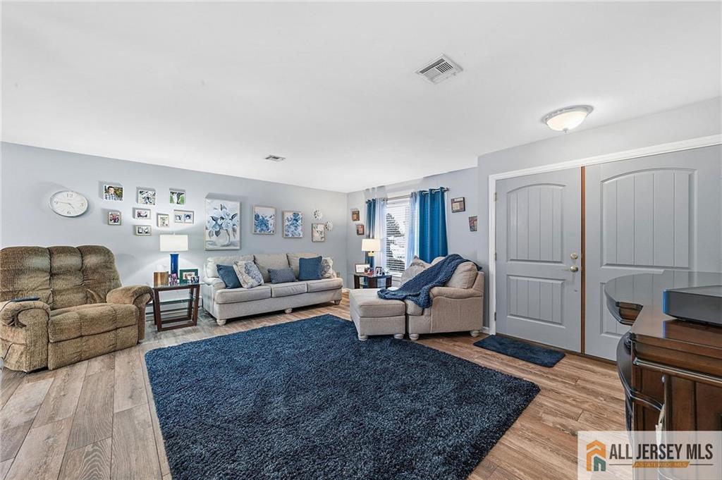 491A Delair Road, Unit 491B Monroe Township, NJ 08831 - Photo 2 of 22 a living room with furniture and a rug