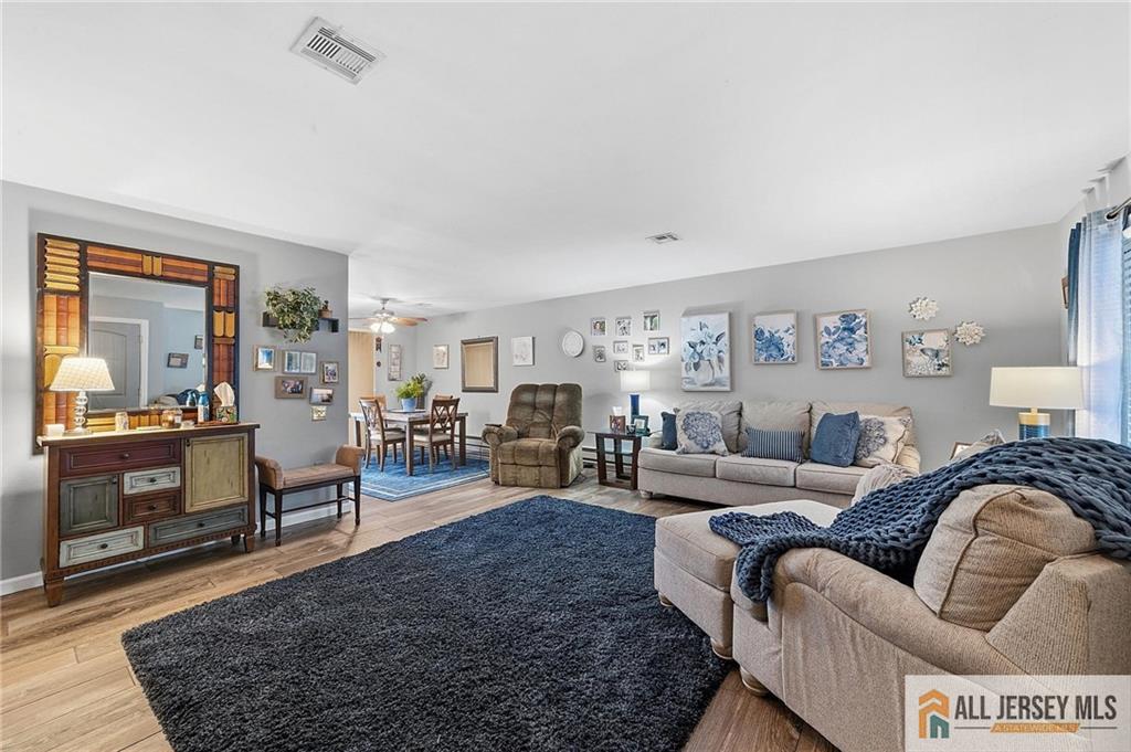 491A Delair Road, Unit 491B Monroe Township, NJ 08831 - Photo 4 of 22 a living room with furniture and a couch