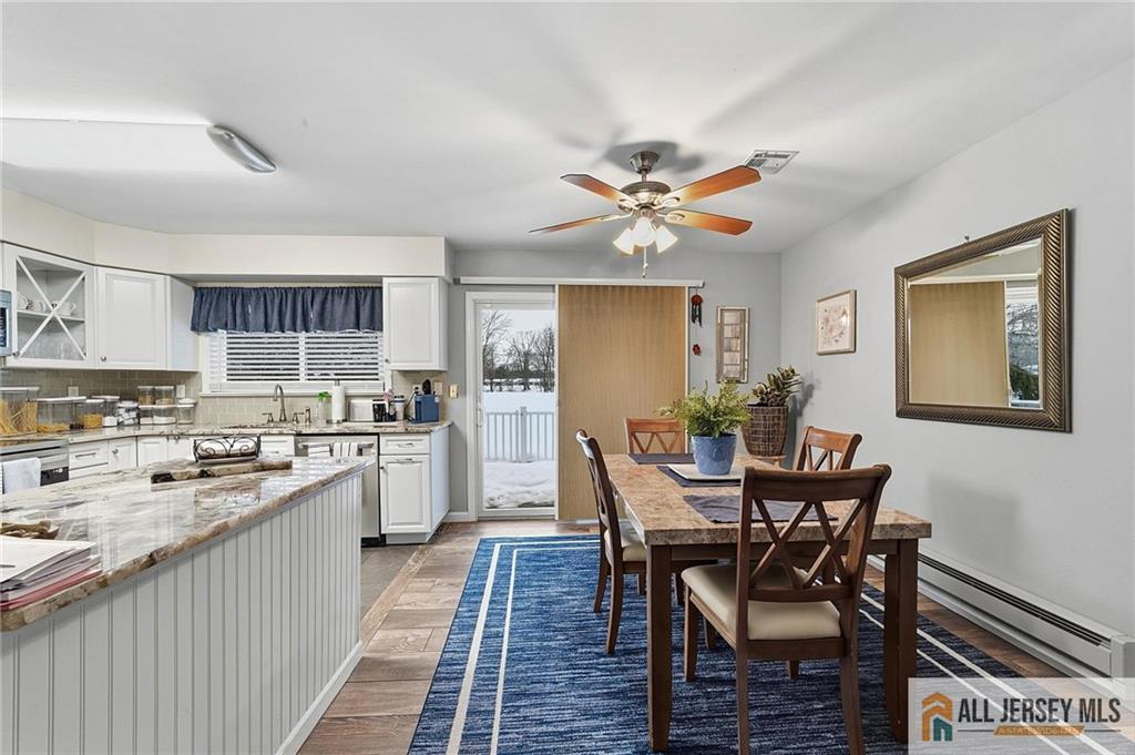 491A Delair Road, Unit 491B Monroe Township, NJ 08831 - Photo 5 of 22 a view of a dining room with furniture and wooden floor