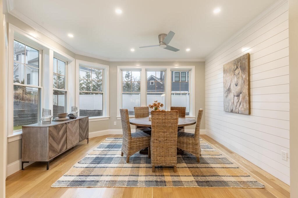 1019 Central Avenue Needham, MA 02492 - Photo 16 of 28 a dining room with wooden floor and windows