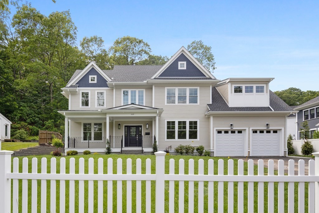 1019 Central Avenue Needham, MA 02492 - Photo 2 of 28 a front view of a house with a porch