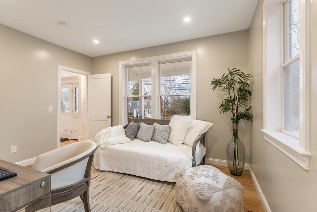 1019 Central Avenue Needham, MA 02492 - Photo 22 of 28 a living room with furniture and a potted plant