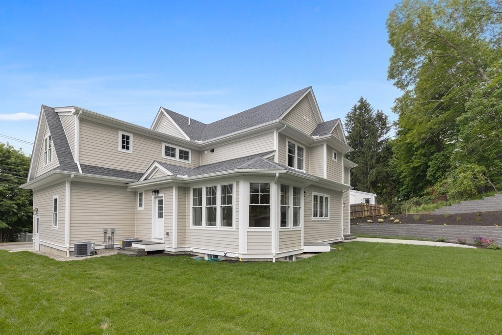 1019 Central Avenue Needham, MA 02492 - Photo 28 of 28 a big house with a big yard and more windows