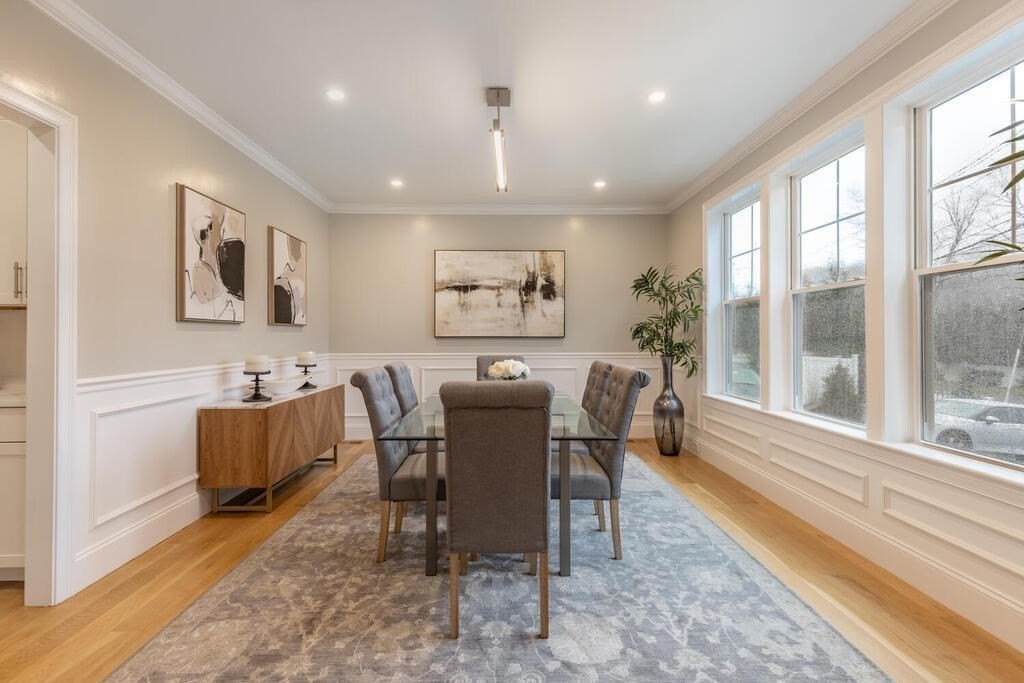 1019 Central Avenue Needham, MA 02492 - Photo 10 of 28 a view of a dining room with furniture a rug and wooden floor