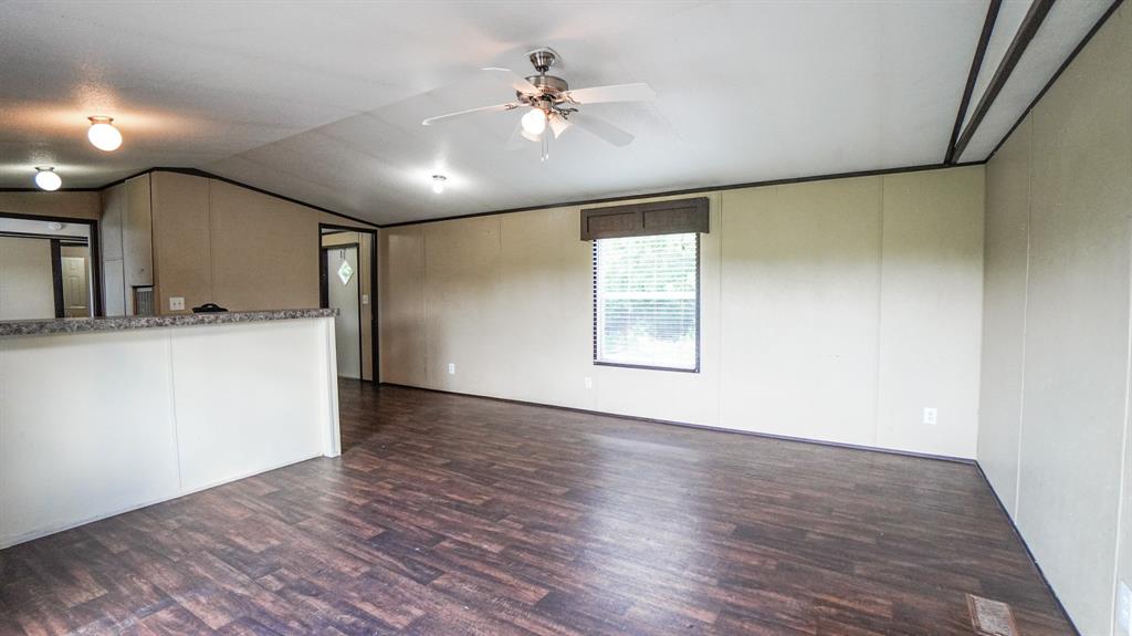 1104 North King Road Fate, TX 75189 - Photo 4 of 15 wooden floor in an empty room with a window