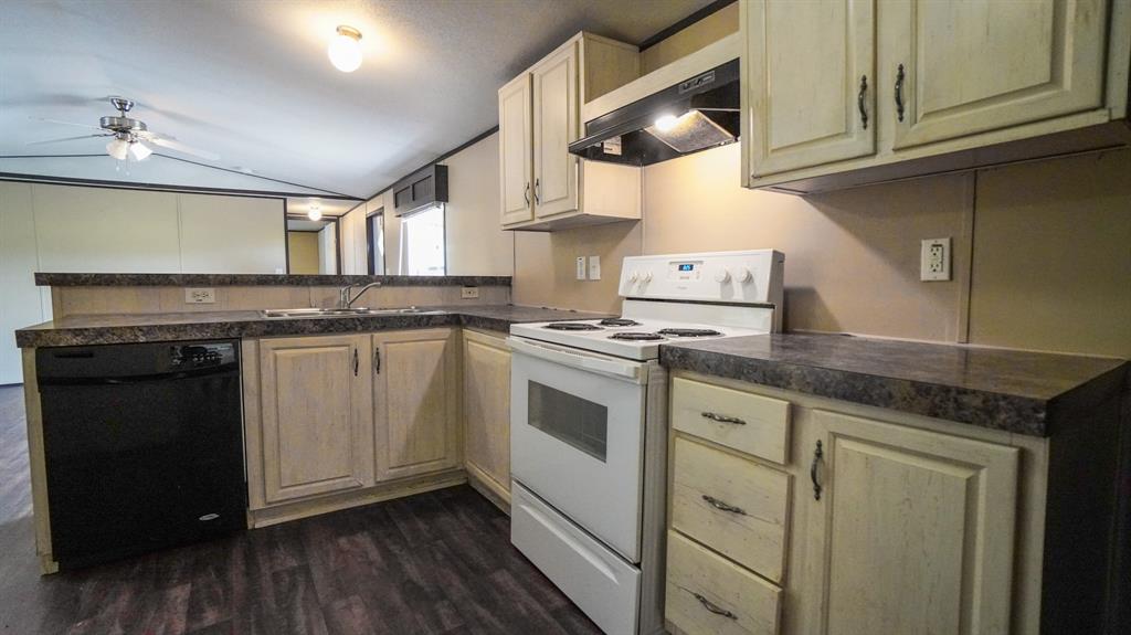 1104 North King Road Fate, TX 75189 - Photo 7 of 15 a kitchen with stainless steel appliances granite countertop a stove and a sink