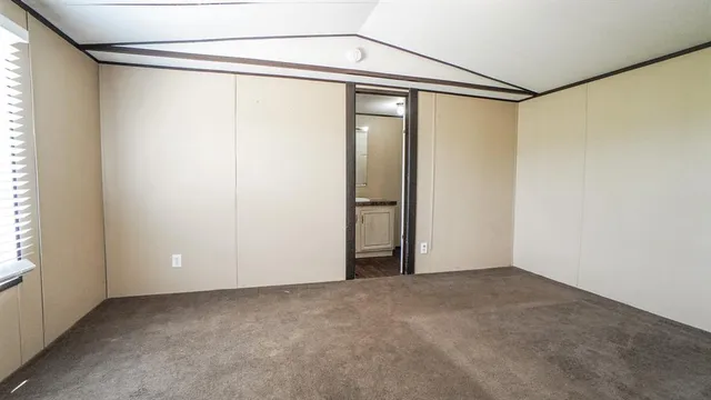 a view of a room with a glass door