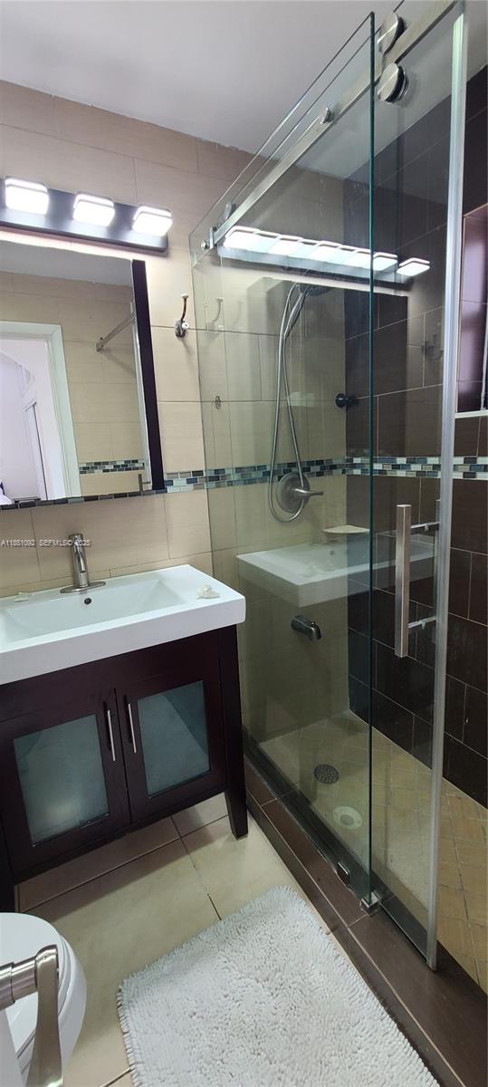 1721 Southwest 24th Terrace Miami, FL 33145 - Photo 52 of 80 a bathroom with a sink and a mirror