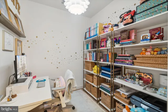 a room with furniture a book shelf and a book shelf