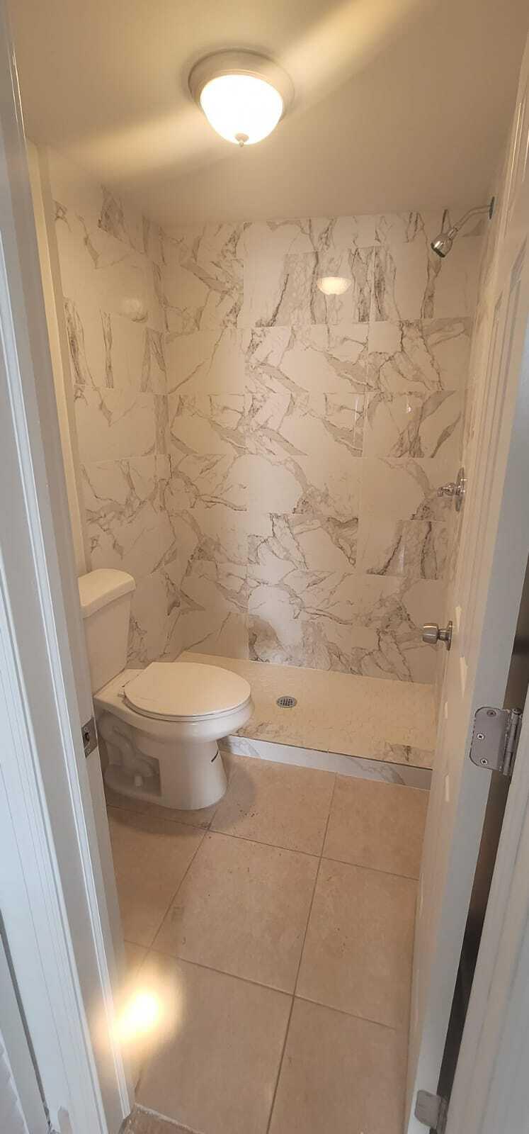 5721 Fillmore Street Hollywood, FL 33021 - Photo 14 of 17 a bathroom with a toilet and a shower