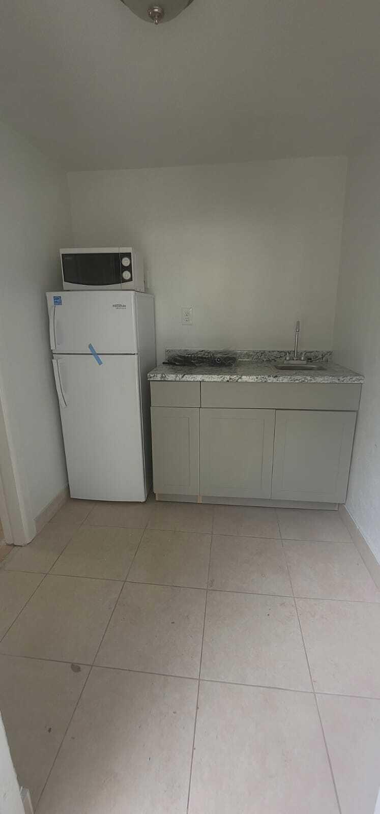 5721 Fillmore Street Hollywood, FL 33021 - Photo 17 of 17 a utility room with a washer and dryer