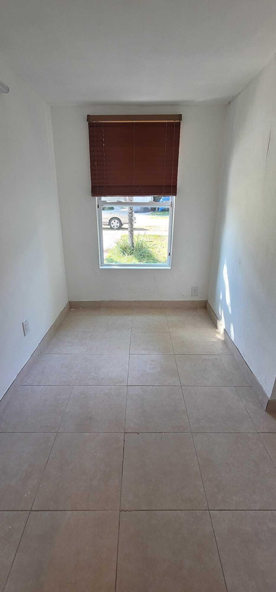 5721 Fillmore Street Hollywood, FL 33021 - Photo 5 of 17 a view of a small space with window and a fireplace
