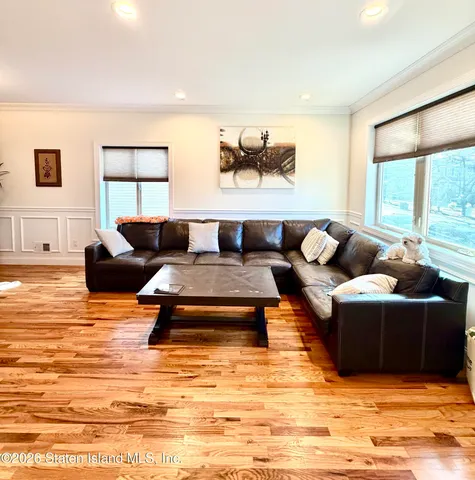 a living room with furniture window and a table