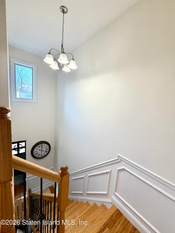 a view of a dining room with furniture and window