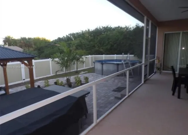 a view of a balcony with furniture