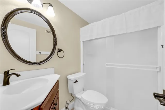 a view of staircase with white walls and railing