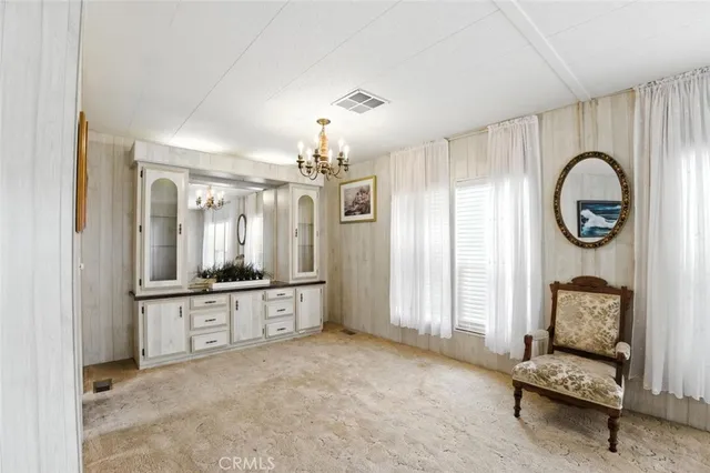 a view of a kitchen with a sink and cabinets
