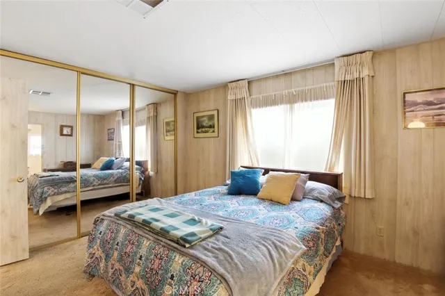 a bathroom with a sink double vanity and a mirror