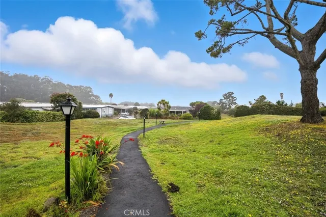 a view of an ocean with a building in the background