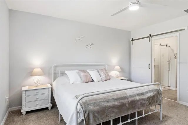 a bedroom with a bed and cabinet