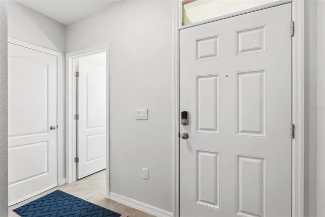 a view of a room with a table and chairs