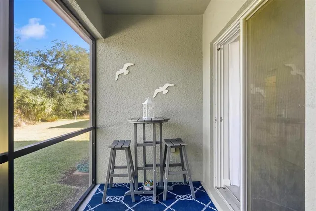 a swimming pool with lots of tress in front of it