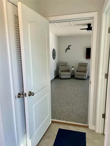 a view of a livingroom with furniture and a ceiling fan