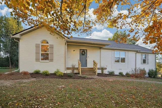 a house view with a backyard space