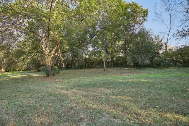 a view of outdoor space with deck and yard