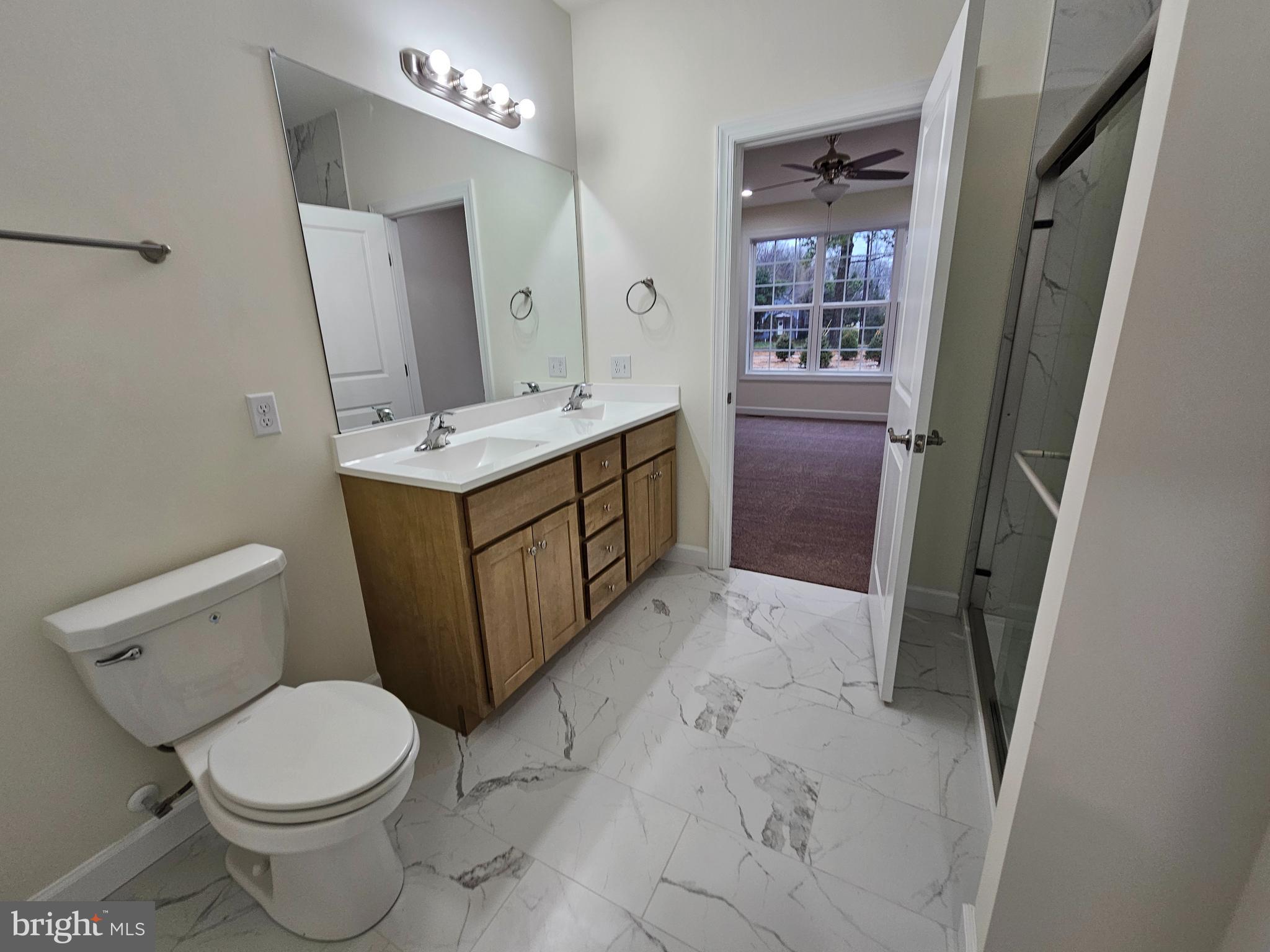 6 Valhalla Court Dover, DE 19904 - Photo 38 of 40 a bathroom with a sink vanity mirror and toilet