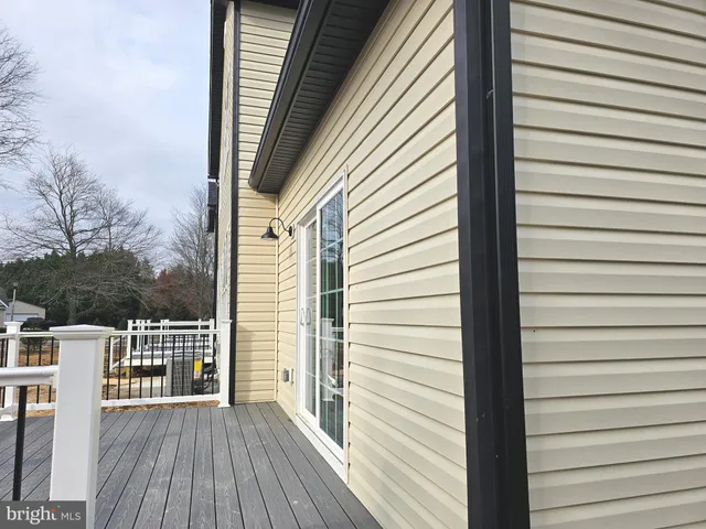 a view of a balcony with wooden floor