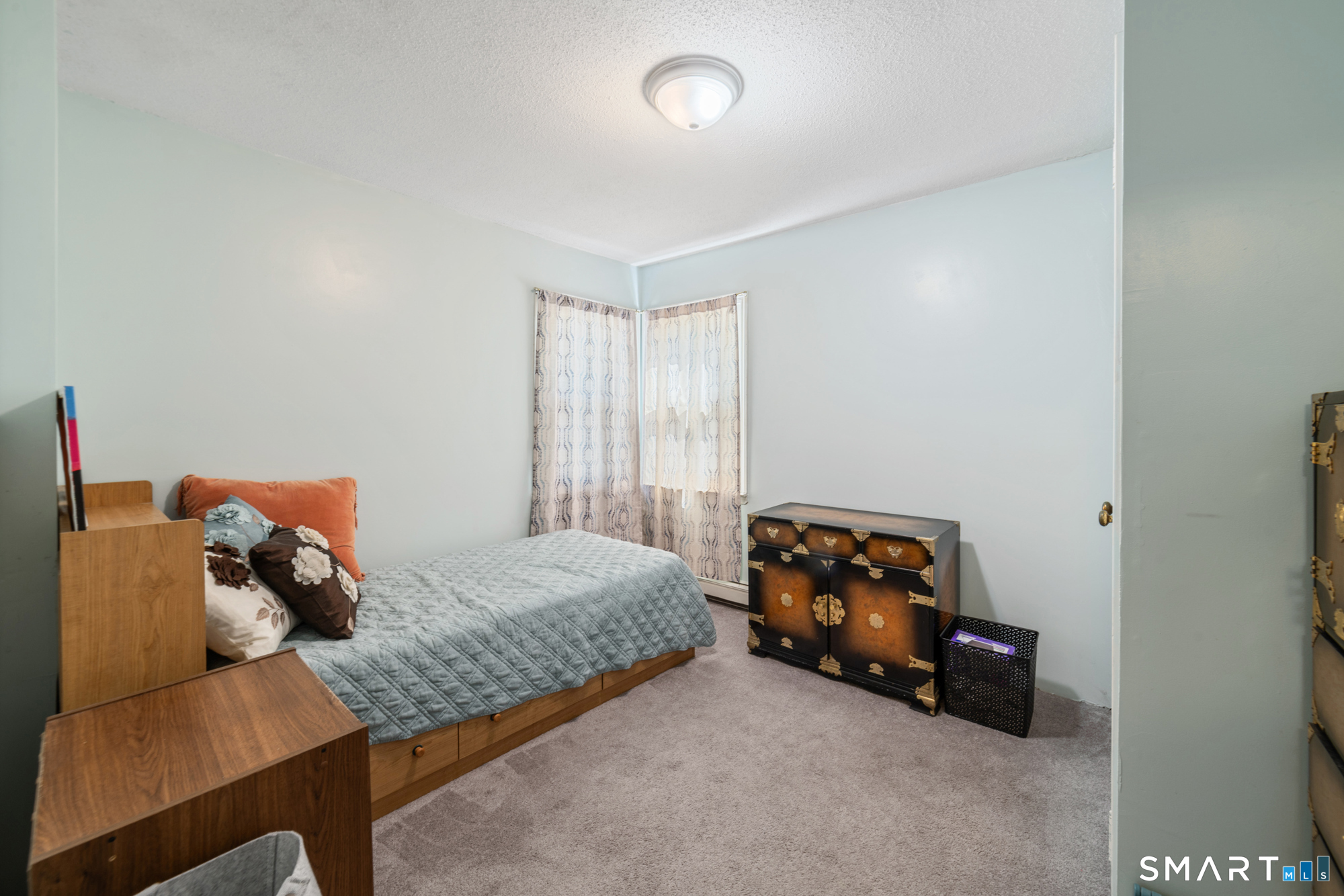 146 Highland Drive Waterbury, CT 06708 - Photo 13 of 31 a bedroom with a bed and a couch