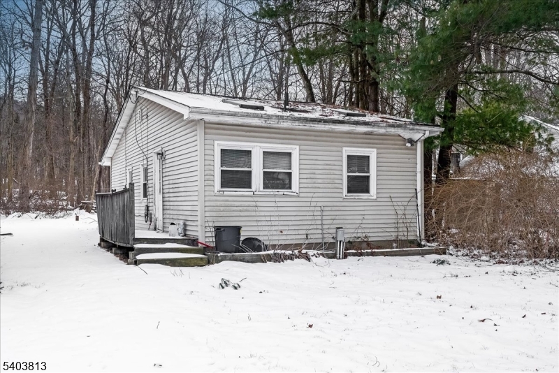 46 Wildwood Road Oak Ridge, NJ 07438 - Photo 1 of 6 a view of a house with a yard