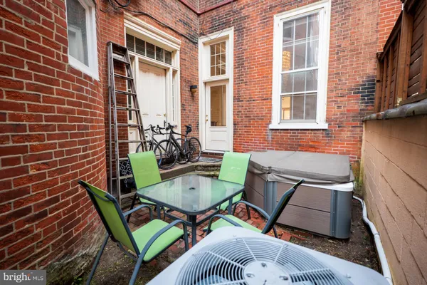 a view of a patio in the backyard