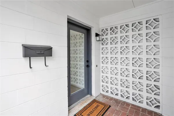 a view of a bedroom with wooden floor and a sink