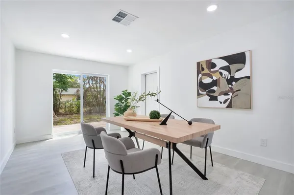 a view of a dining room with furniture window and outside view