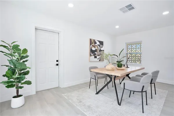 a view of a work space with furniture and a potted plant