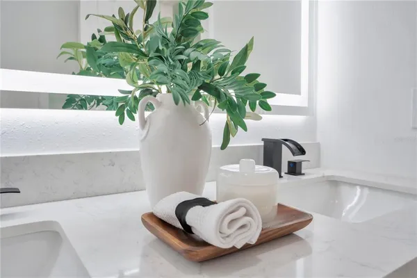 a vase of flowers sitting on a table