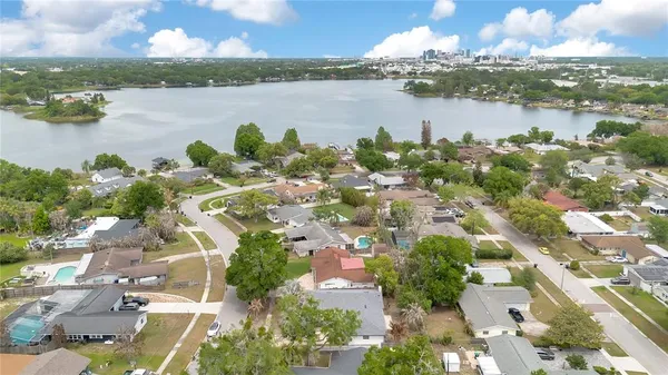 an aerial view of a city with lake view