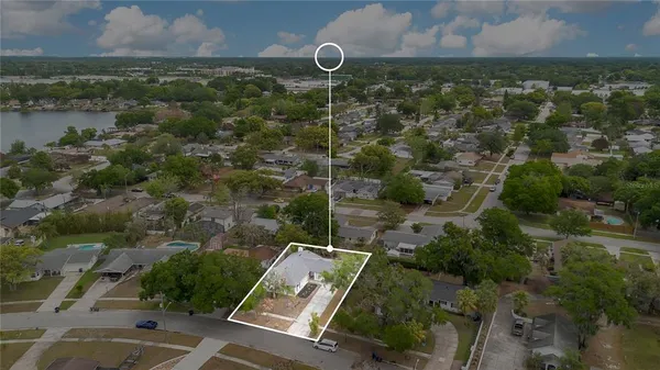 an aerial view of house with yard