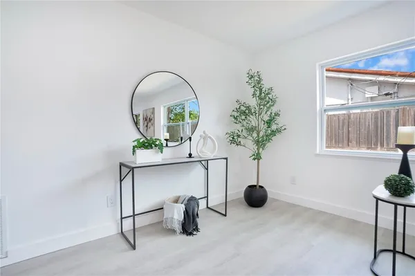 a view of a room with a potted plant