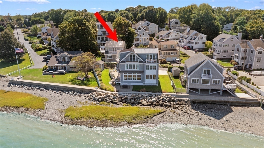 93 Kimball Beach Road Hingham, MA 02043 - Photo 1 of 36 a aerial view of a house with swimming pool and large trees