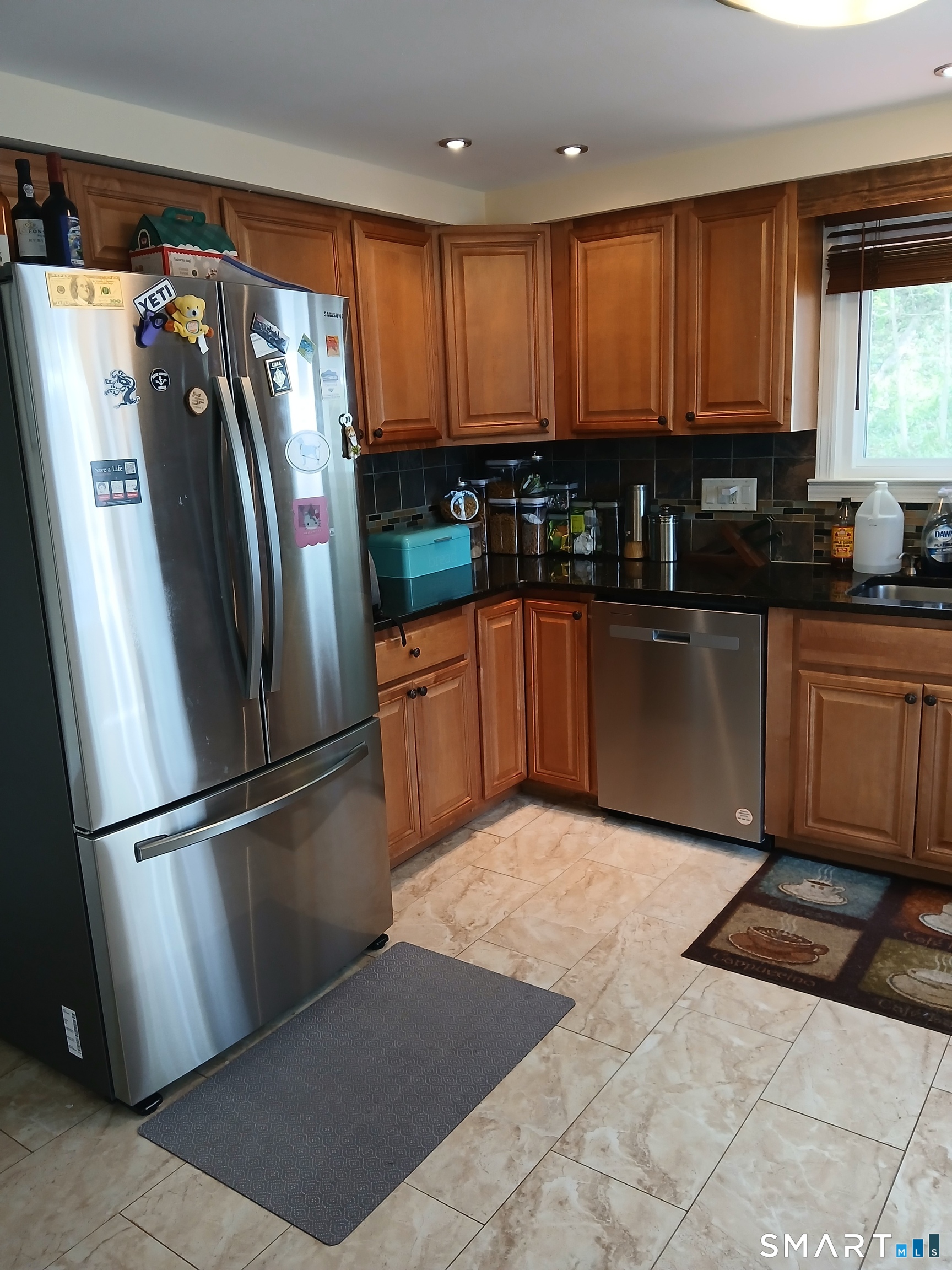 346 Lewis Road New Britain, CT 06053 - Photo 5 of 15 Kitchen view of the Refrigerator and corner Cabinets.