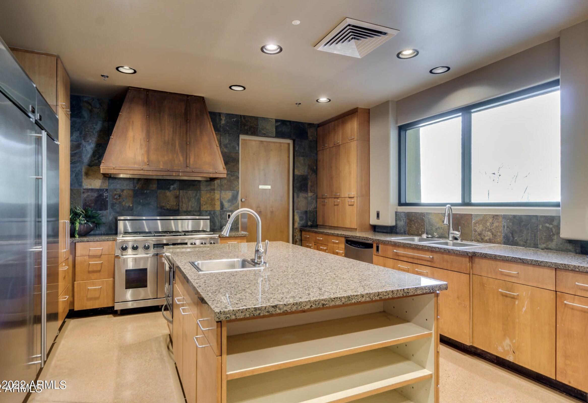 3935 East Rough Rider Road, Unit 1111 Phoenix, AZ 85050 - Photo 28 of 35 Aviano Community kitchen