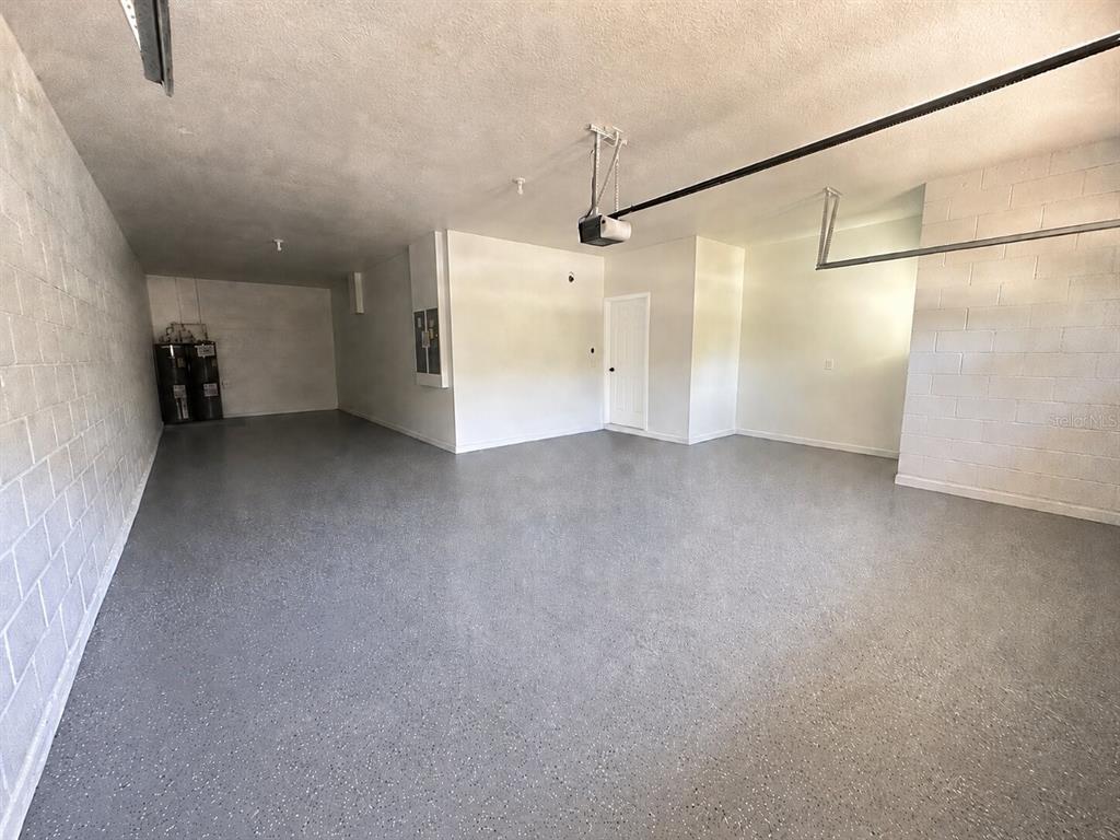 8531 Geddes Loop Orlando, FL 32836 - Photo 18 of 20 a view of a room with a garage